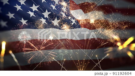 American flag waving with fireworks celebrating 4th of July 91192604