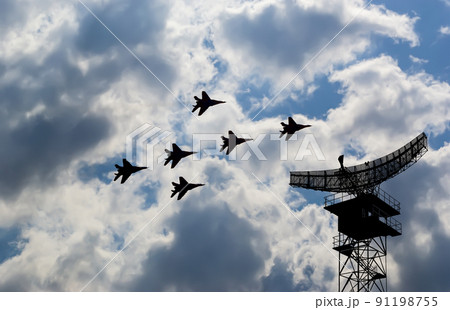 Air defense raiders of military mobile anti-aircraft complexes (radar is designed and automatic tracking of targets and missiles) against the background of the flight of modern combat fighters,Russia Air defense raiders of military mobile anti-aircraft complexes (radar is designed and automatic tracking of targets and missiles) against the background of the flight of modern combat fighters,Russia 91198755