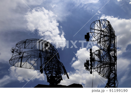 Air defense radars of military mobile anti aircraft systems, modern army industry on background beautiful clouds and sky, Russia Air defense radars of military mobile anti aircraft systems, modern army industry on background beautiful clouds and sky, Russia 91199190