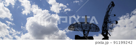 Air defense radars of military mobile anti aircraft systems, modern army industry on background beautiful clouds and sky, Russia 91199242