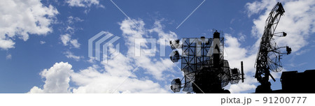 Air defense radars of military mobile anti aircraft systems, modern army industry on background beautiful clouds and sky, Russia 91200777