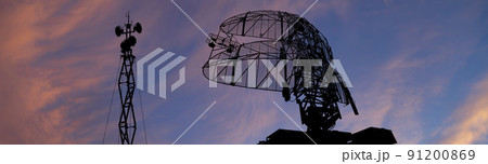 Air defense radars of military mobile anti aircraft systems, modern army industry on the background of the sunset orange sky, Russia 91200869