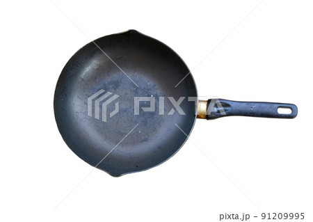old black pan There are yellow stains on the handle. isolated on a white background old black pan There are yellow stains on the handle. isolated on a white background 91209995