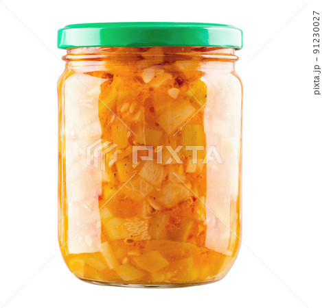 Zucchini slices filled with canning container isolated on white background.  91230027