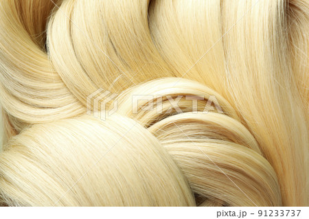 Blonde female hair on whole background, close up Blonde female hair on whole background, close up 91233737