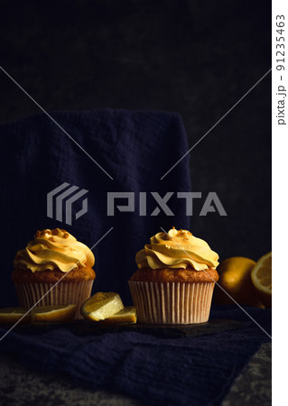 lemon muffins on a dark background 91235463