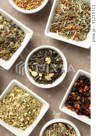 Flat lay with different types of tea on textured background 91235511