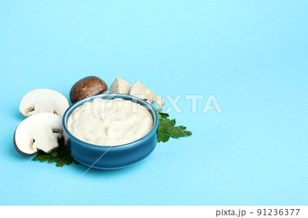 Concept of tasty food with mushroom sauce on blue background 91236377