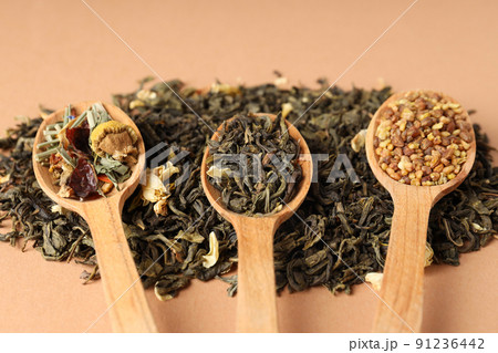 Concept of cooking tea with different types of tea on beige background 91236442