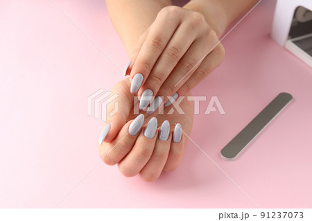 Concept of nail care with female hands on pink background Concept of nail care with female hands on pink background 91237073