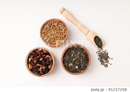 Concept of cooking tea with different types of tea on white background 91237208