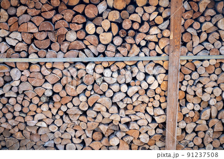 Chopped wood stored for heating in the winter season. 91237508