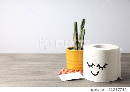 Concept of healthcare with hemorrhoids accessories on wooden table 91237752