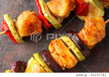 Tasty chicken shashlik on dark textured background 91237781