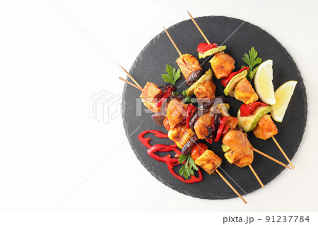 Concept of tasty food with chicken shashlik on white background Concept of tasty food with chicken shashlik on white background 91237784