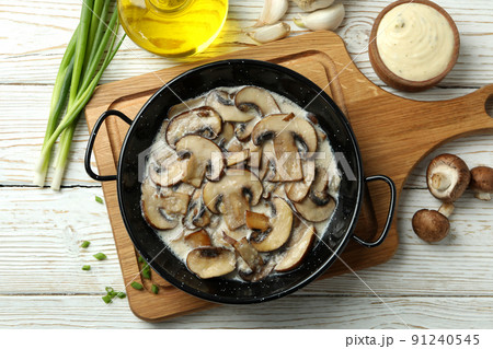 Concept of tasty food with mushroom sauce on white wooden background Concept of tasty food with mushroom sauce on white wooden background 91240545