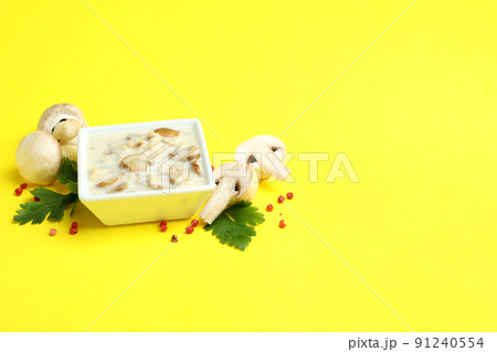 Concept of tasty food with mushroom sauce on yellow background Concept of tasty food with mushroom sauce on yellow background 91240554