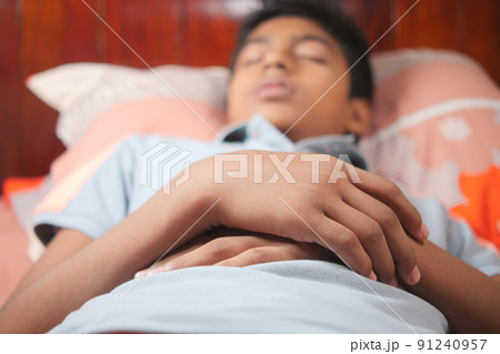 teenage boy boy sleeping in bed, selective focus . 91240957