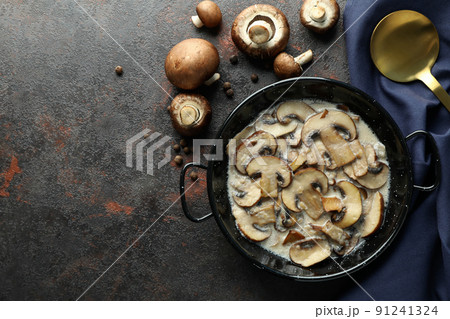 Concept of tasty food with mushroom sauce on dark textured background Concept of tasty food with mushroom sauce on dark textured background 91241324