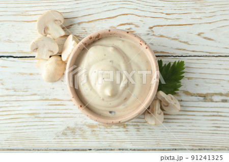Concept of tasty food with mushroom sauce on white wooden background Concept of tasty food with mushroom sauce on white wooden background 91241325