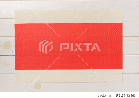 Top view of red tablecloth for food on wooden background. Empty space for your design 91244569