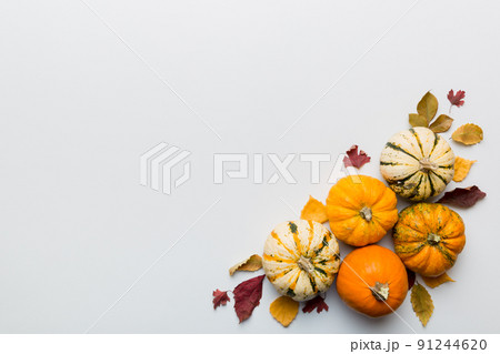 Autumn composition. Pattern made of dried leaves and other design accessories on table. Flat lay, top view 91244620