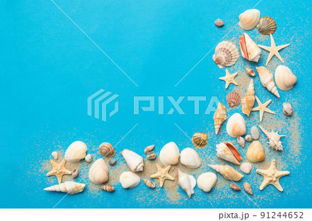 Summer time concept Flat lay composition with beautiful starfish and sea shells on colored table, top view 91244652