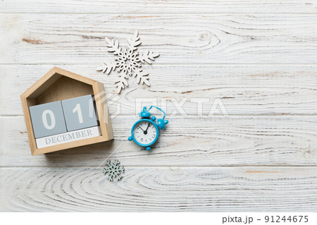 Christmas wood calendar with new year decorations, aganist colored background. Christmas calendar 1 december Christmas wood calendar with new year decorations, aganist colored background. Christmas calendar 1 december 91244675