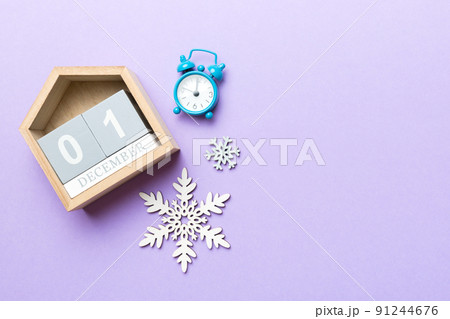 Christmas wood calendar with new year decorations, aganist colored background. Christmas calendar 1 december Christmas wood calendar with new year decorations, aganist colored background. Christmas calendar 1 december 91244676