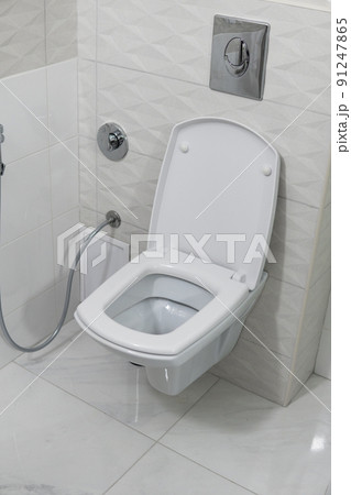 White toilet bowl in modern light bathroom interior. White toilet bowl in modern light bathroom interior. 91247865