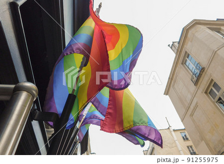 Pride rainbow lgbt gay flag being waved on sky background Pride rainbow lgbt gay flag being waved on sky background 91255975