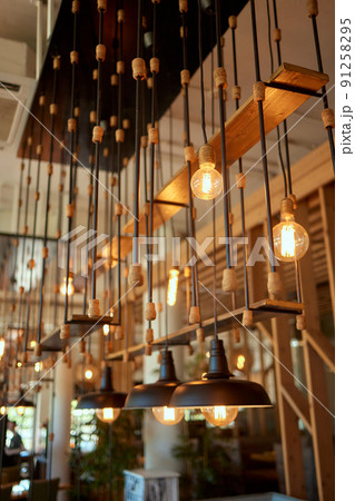 Close up many yellow lamp in cafe at night. 91258295