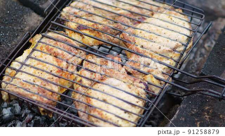 a grate of pickled meat on the grill, bonfire a grate of pickled meat on the grill, bonfire 91258879