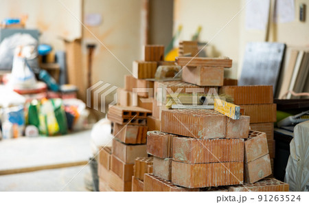 Construction materials inside the building under construction Construction materials inside the building under construction 91263524
