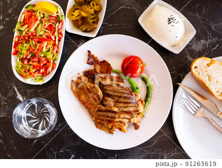 Grilled lamb with tomato and pepper. Turkish cuisine Grilled lamb with tomato and pepper. Turkish cuisine 91263619