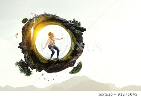 Young woman riding her skateboard 91275045