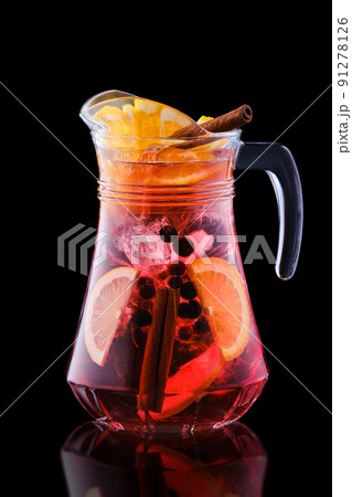 Pitcher with cold sangria isolated on black 91278126