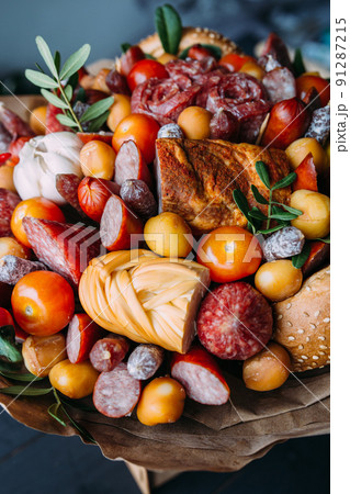Delicious edible bouquet of sausage, tomatoes, cheese. Gift for man. Delicious edible bouquet of sausage, tomatoes, cheese. Gift for man. 91287215
