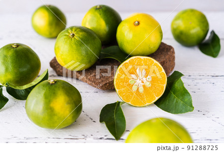 Mapo fruits on the white wooden table and stone stand Mapo fruits on the white wooden table and stone stand 91288725