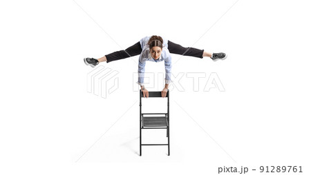 Portrait of woman, office worker in casual clothes jumping in twine isolated over white background 91289761