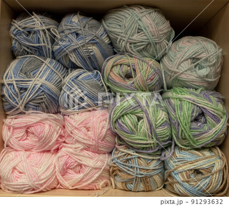 Close Up of yarn balls. Rainbow colors. Yarn for knitting. Skeins of yarn. Knitting needles, colorful threads. Knitting background, Knitting yarn for handmade winter clothes Close Up of yarn balls. Rainbow colors. Yarn for knitting. Skeins of yarn. Knitting needles, colorful threads. Knitting background, Knitting yarn for handmade winter clothes 91293632