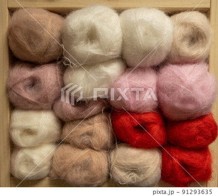 Close Up of yarn balls. Rainbow colors. Yarn for knitting. Skeins of yarn. Knitting needles, colorful threads. Knitting background, Knitting yarn for handmade winter clothes. 91293635