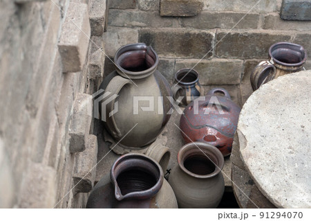 opening of a ceramic kiln, Unique handmade pots and dishes of clay getting black after firing and oxygen reducing process in wood fire kiln. Latvian national crafts opening of a ceramic kiln, Unique handmade pots and dishes of clay getting black after firing and oxygen reducing process in wood fire kiln. Latvian national crafts 91294070