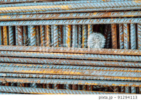 Metal fittings for reinforced concrete. Main construction materials. Background and rusty iron reinforcement rods. Red orange color of iron oxide on reinforcement bars Metal fittings for reinforced concrete. Main construction materials. Background and rusty iron reinforcement rods. Red orange color of iron oxide on reinforcement bars 91294113
