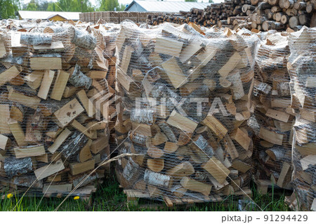 Firewood stored in heavy duty bags with two vented sides for faster drying. 91294429