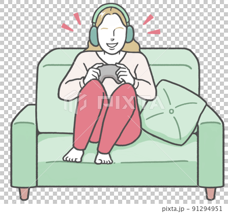 A young western woman wearing headphones, sitting on the couch and enjoying a video game alone A young western woman wearing headphones, sitting on the couch and enjoying a video game alone 91294951