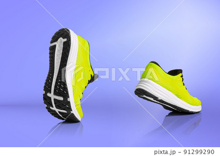Strolling sports shoes on lilac color background. Sneakers or trainers isolated. Athletic shoes. fitness, sport, training concept. Urban fashion 91299290
