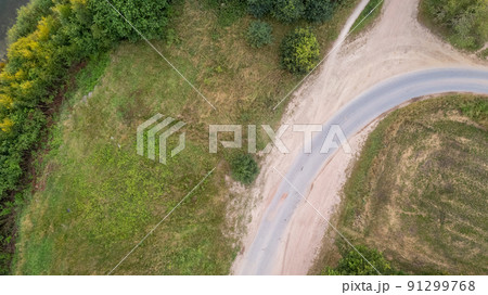 Drone image. aerial view of rural area with fields, trees, paths and roads Drone image. aerial view of rural area with fields, trees, paths and roads 91299768