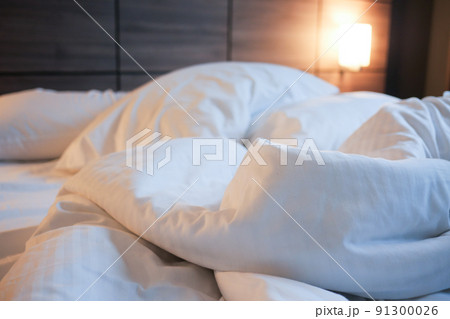 messy bed in early morning , messy bed after waking up  91300026