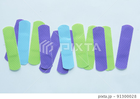 colorful adhesive bandage on white background  91300028